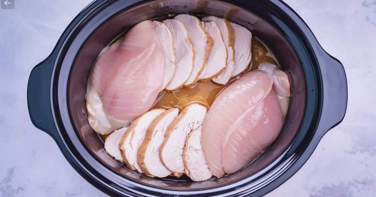 Cook thin-sliced chicken breast in crockpot