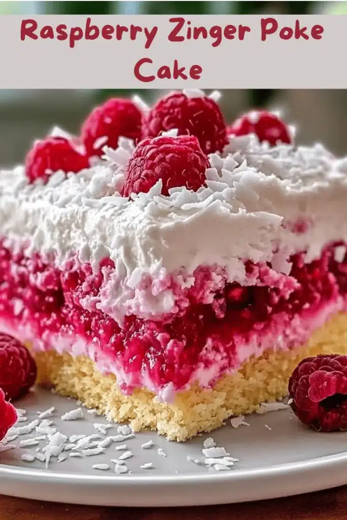Beautifully plated slice of Raspberry Zinger Poke Cake with whipped topping, raspberry gelatin, and coconut