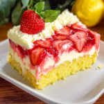 Slice of strawberry lemonade poke cake with whipped topping