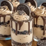 Cookies and cream mousse cups in glass jars with Oreo topping