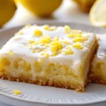 lemon brownies with lemon glaze on white plate