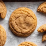 chewy pumpkin cookies on parchment paper fresh from oven