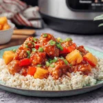 Easy Sweet Hawaiian Crockpot Chicken with pineapple, red bell peppers, and rice