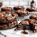 Fudgy chewy brookies stacked with crackly tops and gooey chocolate center